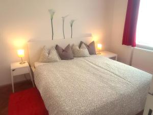 Łóżko lub łóżka w pokoju w obiekcie City-Apartments Langegger