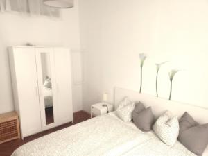 Łóżko lub łóżka w pokoju w obiekcie City-Apartments Langegger