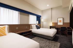 Letto o letti in una camera di Four Points Flex by Sheraton Osaka Umeda
