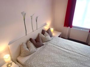 Łóżko lub łóżka w pokoju w obiekcie City-Apartments Langegger
