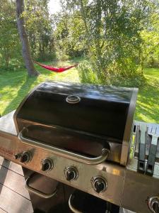 een grill met een zwarte top erop bij Unique, Artistic House With Fjord View in Holbæk