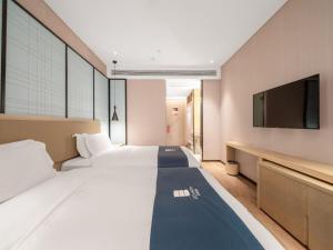 Μια τηλεόραση ή/και κέντρο ψυχαγωγίας στο Yishang Hotel Binzhou Boxing Ginza Branch