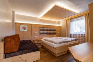 Posteľ alebo postele v izbe v ubytovaní Ciasa Iachin - Dolomites Dream Retreat