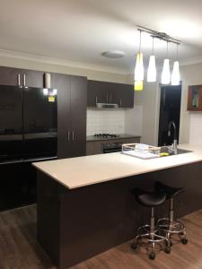 a kitchen with a large island with a counter top at Private Bedroom in Sharehouse in Rosslea
