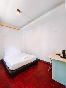 Ένα ή περισσότερα κρεβάτια σε δωμάτιο στο GO INN Silom BTS Surasak สถานีสุรศักดิ์