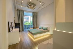 Postel nebo postele na pokoji v ubytování Q Hotel & Apartment Da Nang