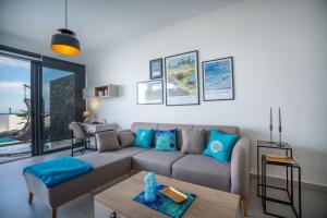 a living room with a couch and a table at Lighthouse Family Apartment with Private Pool in Kyrenia +46 photos