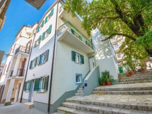 a building with stairs in front of it at Apartments Angelina - 2min to the beach in Karlobag