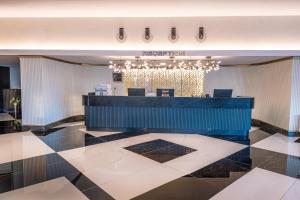 a lobby with a reception desk in a building at The X Belek in Belek