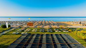 an aerial view of a beach with umbrellas at The X Belek in Belek