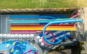 a water park with a colorful water slide at The X Belek in Belek