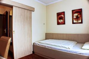 Postel nebo postele na pokoji v ubytování M&M Hotel - Seevetal