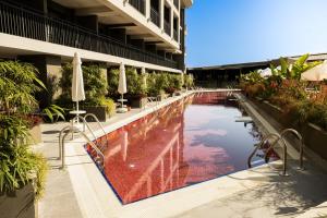 a swimming pool in the middle of a building at The X Belek in Belek