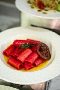 a plate of red vegetables on a white plate at The X Belek in Belek