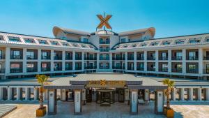 a large building with a star on the top of it at The X Belek in Belek