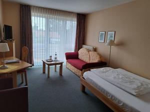 TV a/nebo společenská místnost v ubytování Hotel Heikenberg