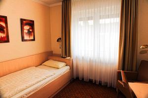 Postel nebo postele na pokoji v ubytování M&M Hotel - Seevetal