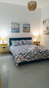 Ένα ή περισσότερα κρεβάτια σε δωμάτιο στο Residence Spiaggia Centro - Aria Condizionata Wi-Fi&SelfCheck-In - Sole&Mare Home