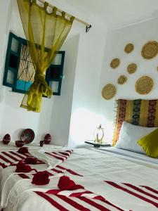 Postel nebo postele na pokoji v ubytování Riad rajad Marrakech