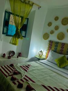 Postel nebo postele na pokoji v ubytování Riad rajad Marrakech