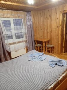Postel nebo postele na pokoji v ubytování микуличин на долоні