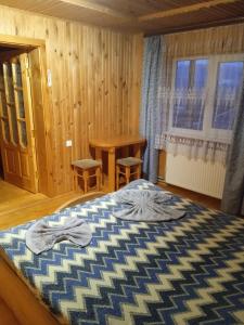 Postel nebo postele na pokoji v ubytování микуличин на долоні