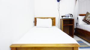 Postel nebo postele na pokoji v ubytování Namal Homestay Sigiriya