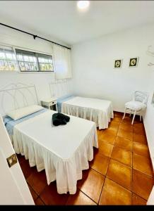 Ένα ή περισσότερα κρεβάτια σε δωμάτιο στο Buganvilla 56