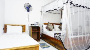 Postel nebo postele na pokoji v ubytování Namal Homestay Sigiriya