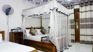 Postel nebo postele na pokoji v ubytování Namal Homestay Sigiriya