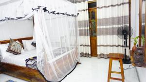 Postel nebo postele na pokoji v ubytování Namal Homestay Sigiriya