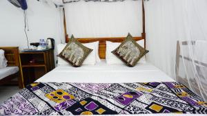 Postel nebo postele na pokoji v ubytování Namal Homestay Sigiriya