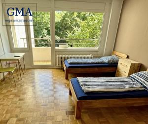 Postel nebo postele na pokoji v ubytování 4-Zimmer-Wohnung 100
