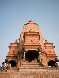 a building with people sitting on top of it at Bhaktapur Homestay in Bhaktapur