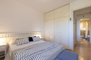 Postel nebo postele na pokoji v ubytování UHC Cye Apartments