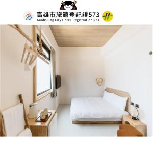 Postel nebo postele na pokoji v ubytování Just Inn Kaohsiung