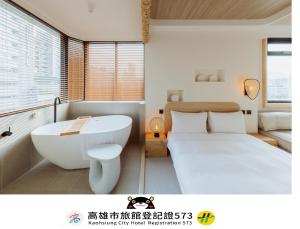 Postel nebo postele na pokoji v ubytování Just Inn Kaohsiung