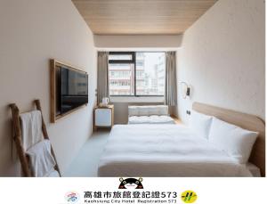 Postel nebo postele na pokoji v ubytování Just Inn Kaohsiung