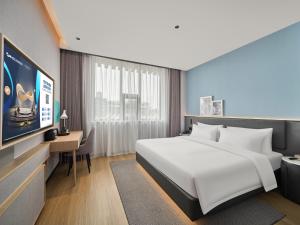 Ліжко або ліжка в номері Country Inn&Suites By Radisson, Xi'an Bell and Drum Tower Flagship