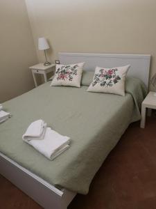 Ένα ή περισσότερα κρεβάτια σε δωμάτιο στο Relais Cora