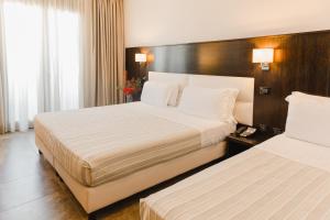 Basiliani - CDSHotels客房内的一张或多张床位