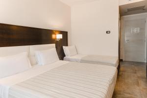Basiliani - CDSHotels客房内的一张或多张床位