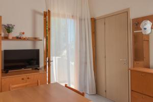 TV a/nebo společenská místnost v ubytování Costa del Salento - CDSHotels