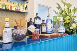 a counter with many bottles of alcohol on it at Grand Hotel Riviera - CDSHotels in Santa Maria al Bagno