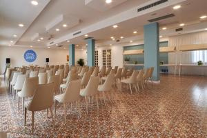 a room with rows of chairs in a hall at Grand Hotel Riviera - CDSHotels in Santa Maria al Bagno