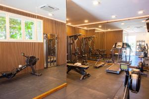 a gym with several tread machines in a room at Grand Hotel Riviera - CDSHotels in Santa Maria al Bagno