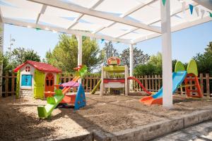 a playground with play equipment in the sandbox at Grand Hotel Riviera - CDSHotels in Santa Maria al Bagno