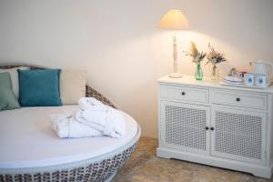Łóżko lub łóżka w pokoju w obiekcie Marenea Suite Hotel - CDSHotels