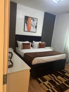 Voodi või voodid majutusasutuse Florence Hotel and suites toas