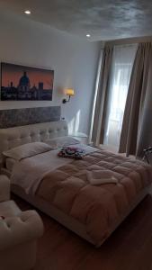 A bed or beds in a room at Albergo la Svolta